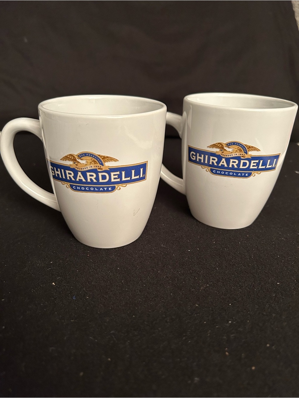 Set of 2 White Ceramic Mugs with the Ghirardelli Chocolate logo